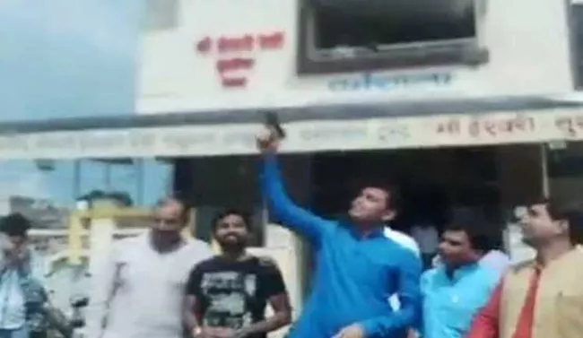 BJP Youth Wing Leaders Fire Celebratory Shots In Air - Sakshi