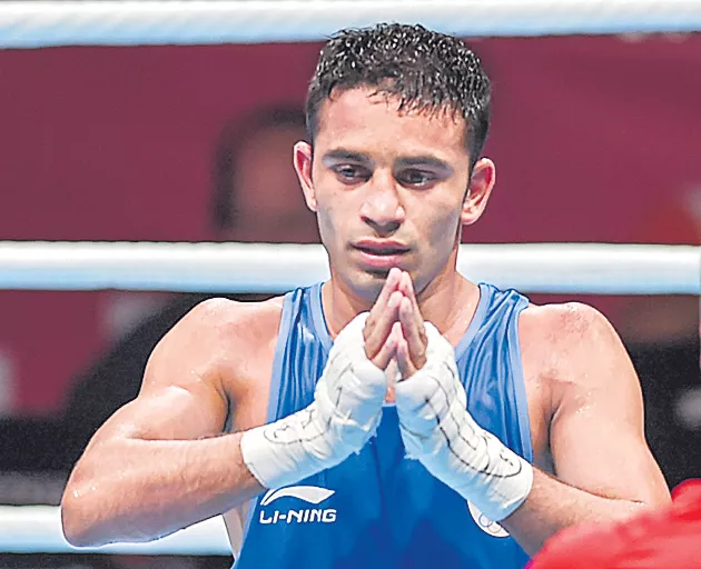 Asian Games gold medallist boxer Amit Panghal nominated for Arjuna award - Sakshi