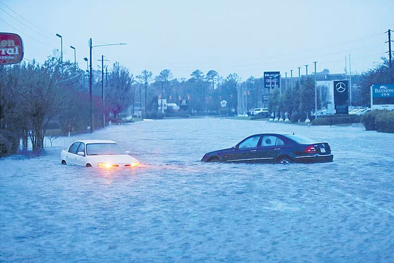 At Least 5 Deaths Reported as Storm Dumps Rain on Carolinas - Sakshi