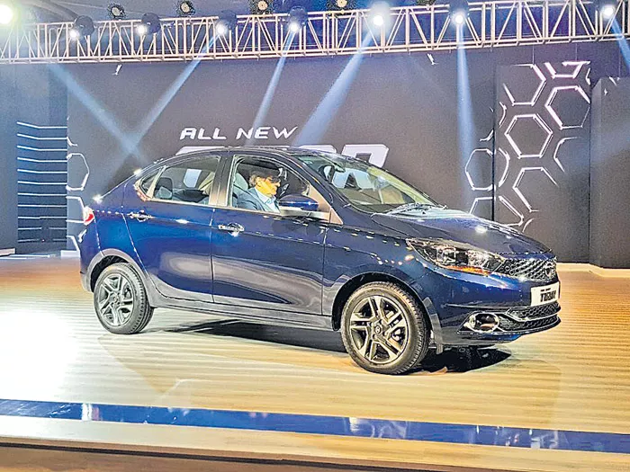  Tata Motors drives in new Tigor at Rs 5.20 lakh - Sakshi