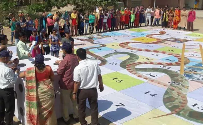 Snake And Ladder Game Introduced For Awareness In Voters In Barmer - Sakshi