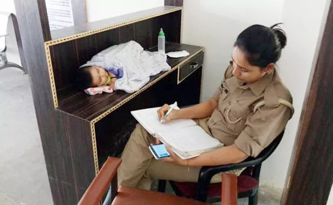 Mother Cop With Baby At Work In UP Police Says Plan Creches - Sakshi