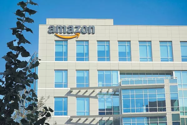 Amazon raising minimum wage for US workers to $15 per hour - Sakshi