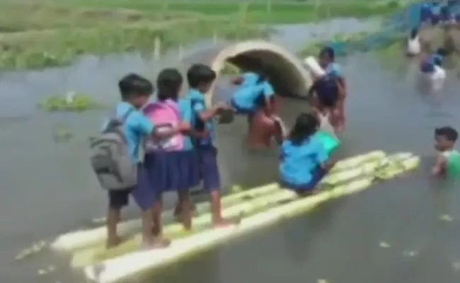 Students Going To School In Banana Stems To Cross Floods In Assam - Sakshi