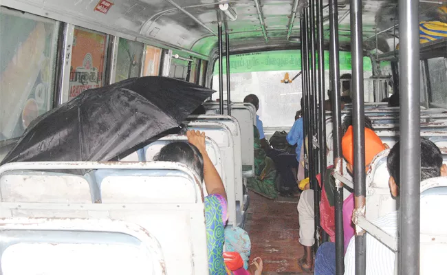 Passengers Use Umbrellas in Damaged Bus Tamil Nadu - Sakshi