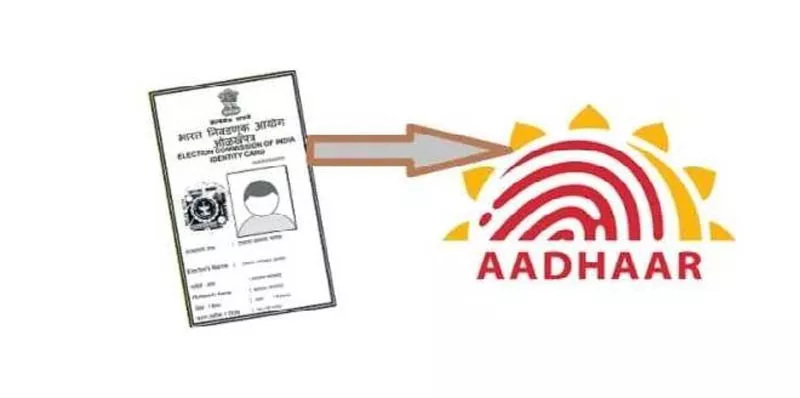 Aadhaar-linked electoral rolls and voter cards - Sakshi