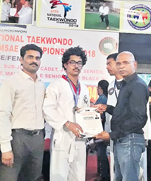 Shiva Kumar gets Silver Medal in Taekwondo Championship - Sakshi