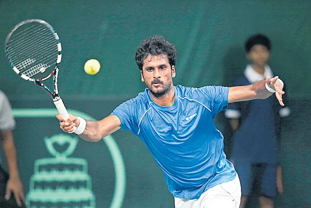 Saketh Myneni enter to 2nd round - Sakshi