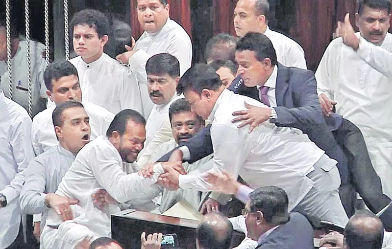 Sri Lanka MPs fight in parliament as power struggle deepens - Sakshi