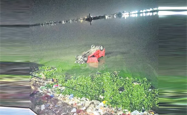 Car Roll Over in Hussain Sagar Hyderabad - Sakshi