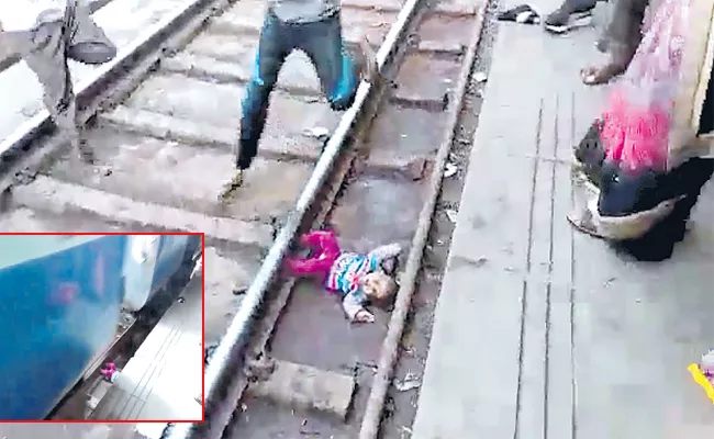 Girl Child Safe From Train Track Uttarapradesh - Sakshi