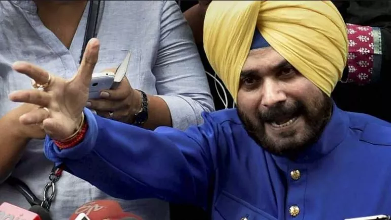 Navjot Singh Sidhu Said It Was Just A Hug Not A Rafale Deal - Sakshi