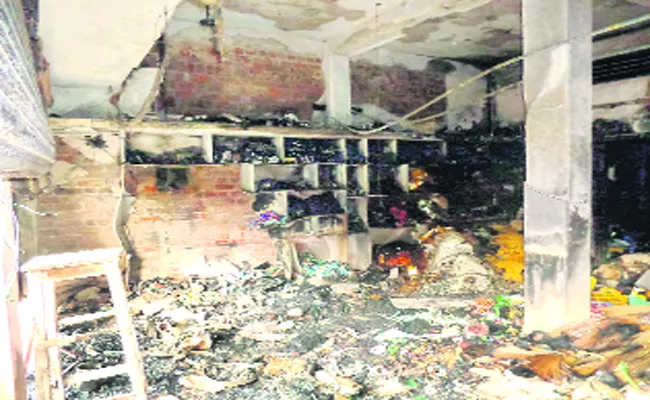 Fire Accident at a grocery store,Warangal - Sakshi