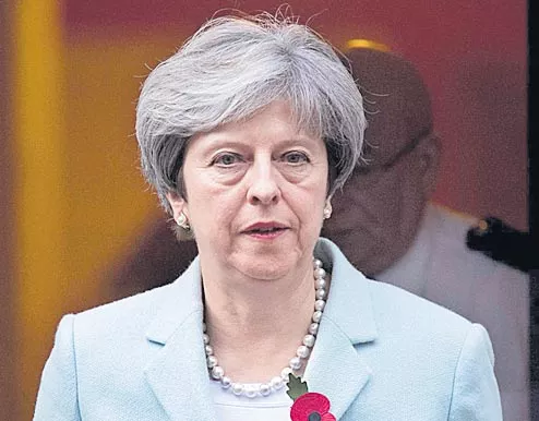 Theresa May postpones Brexit deal vote - Sakshi