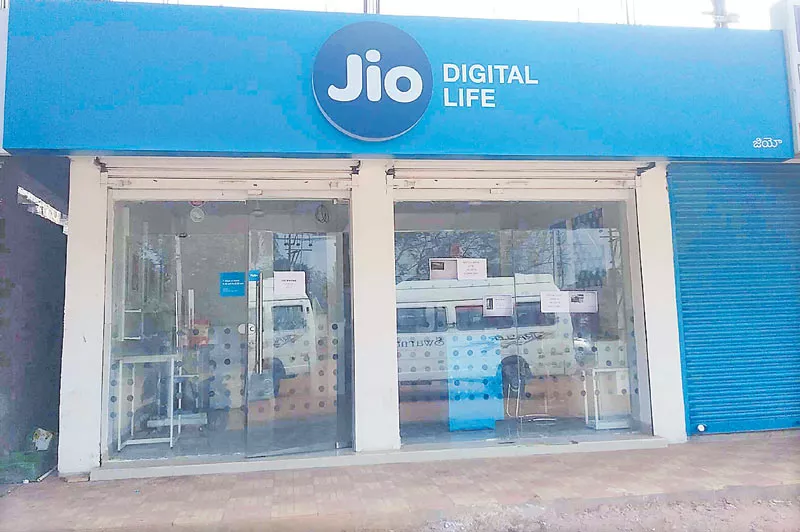 Mukesh Ambani may use his 5100 Jio Point stores to kick off a retail bussiness - Sakshi