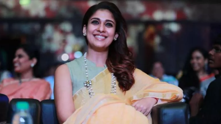 In Adorable Video Nayanthara Playing With Child At Shooting Spot Is To Cute - Sakshi