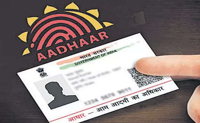 Aadhaar seeding with mobile numbers, bank account - Sakshi