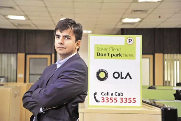 Ola invests  usd 100 million in scooter-sharing startup Vogo - Sakshi