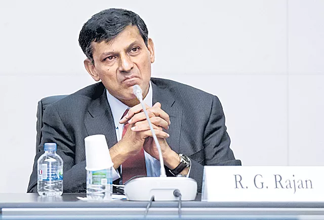 Transfer of excess reserve may pull down credit rating of RBI: Raghuram Rajan  - Sakshi