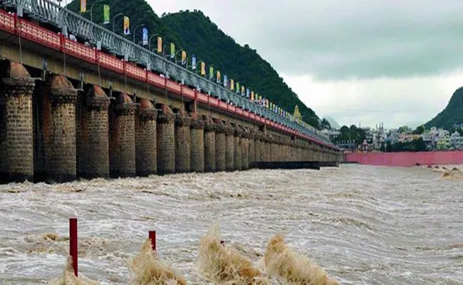 Heavy Rain Water to Prakasam Barrage - Sakshi