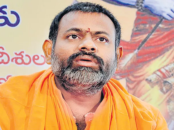 Swami Purnananda fires on Congress and TRS - Sakshi