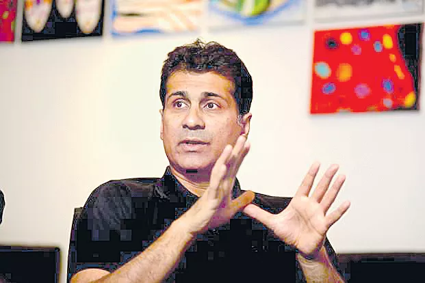  No wishlist, watching Budget waste of time: Rajiv Bajaj - Sakshi