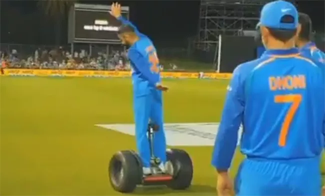 Virat Kohli And MS Dhoni Enjoyed Riding A Segway - Sakshi