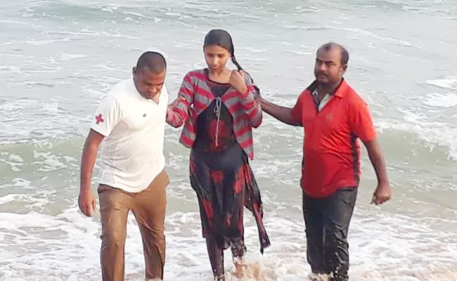 Life Guards Saved Young Women in Beach - Sakshi