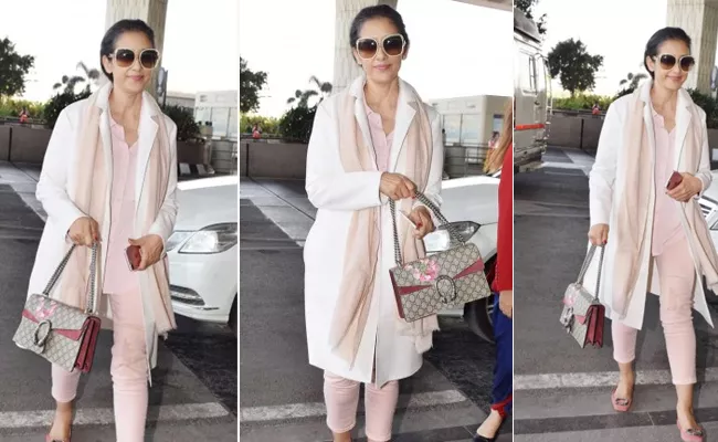 Manisha Koirala Pairs Costly Bag At The Airport - Sakshi