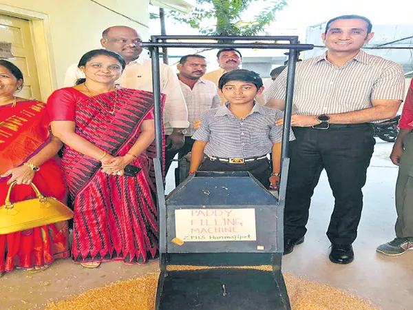 Abhishek paddy filling and netting machines in the Godowns - Sakshi