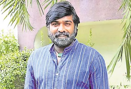 Vijay Sethupathi gifts Royal Enfield bike to 96 director Prem Kumar - Sakshi