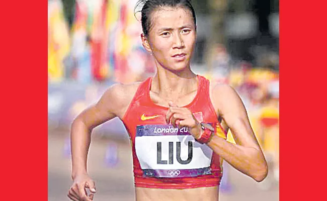 Chinese woman sets record for 50K race walk - Sakshi