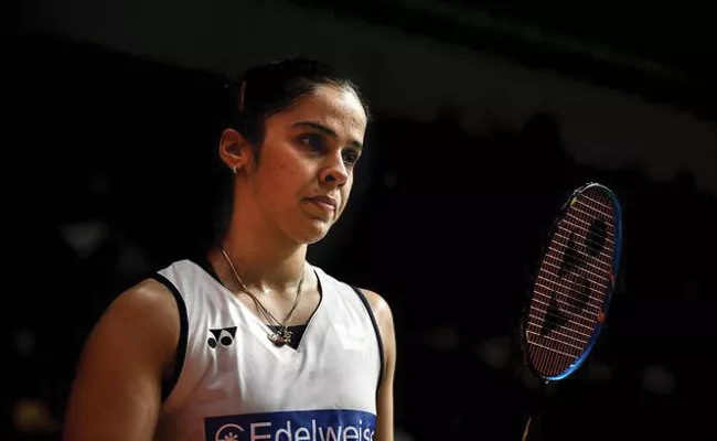 Saina to undergo surgery for stomach pain, skips Swiss Open - Sakshi