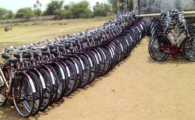 Voilating Election Code Of Conduct By Distributing Bicycles - Sakshi