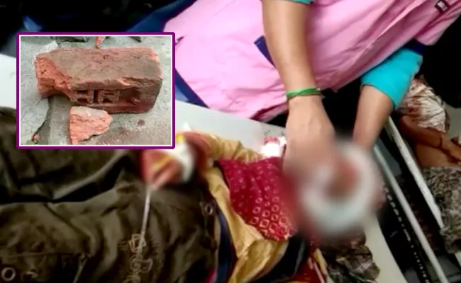 In Peddapalli District Mother Beating Children With Brick - Sakshi