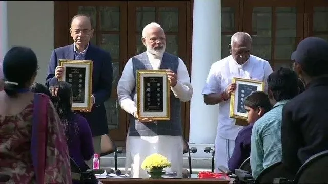 Prime Minister Narendra Modi on Thursday Released  The New Coins - Sakshi