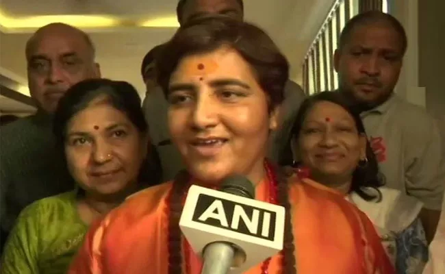 Sadhvi Pragya singh joins BJP, may contest against Digvijaya Singh  - Sakshi