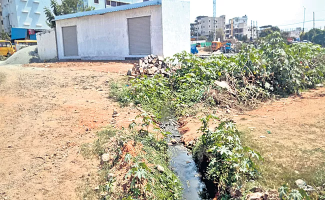 constructions in Pond Lake in Rajendranagar - Sakshi