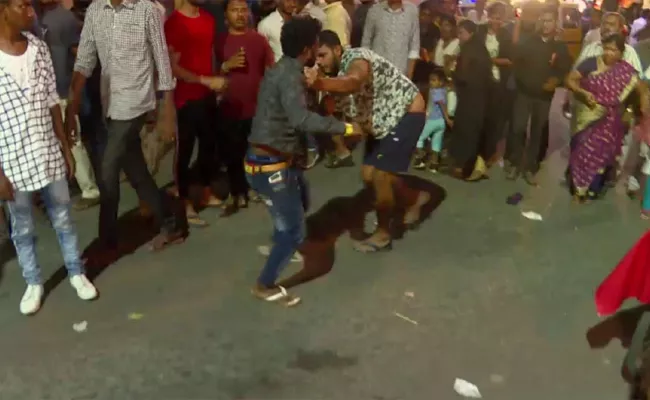  two guys fighting on street for a girl friend in karnataka - Sakshi