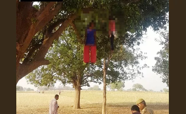 Two Girls Found Dead Hanging From Tree In UP - Sakshi