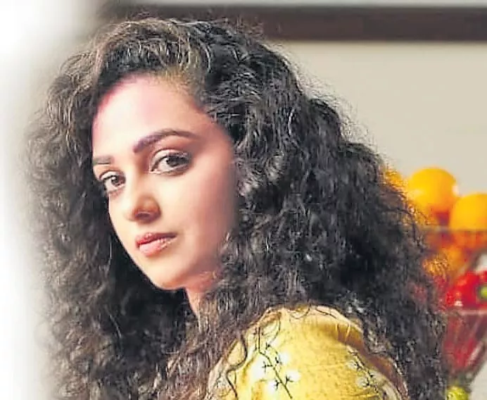 Producers threaten to ban Nithya Menen for not meeting them - Sakshi