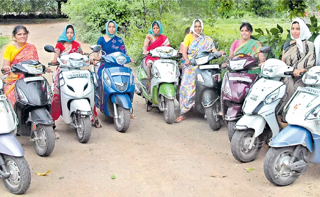 Jagityala District Womens younger farmers are farming on scooters - Sakshi