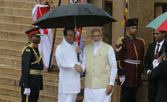 PM Modi meets Sri Lankan President Sirisena - Sakshi