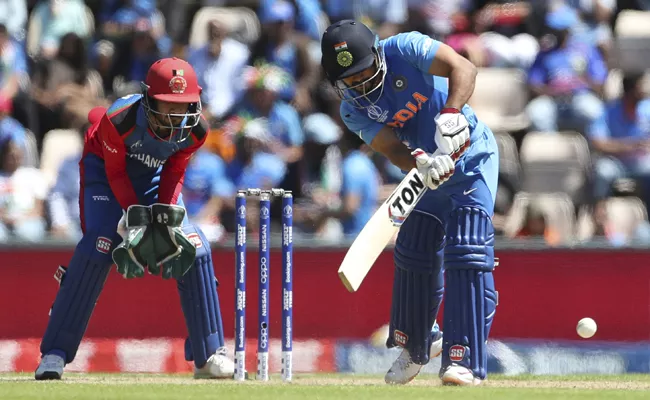 Jadhav, Kohli fifties propel India to 224 Against Afghanistan - Sakshi