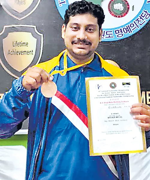 Rakesh Gets Two Medals in Taekwondo Championship - Sakshi