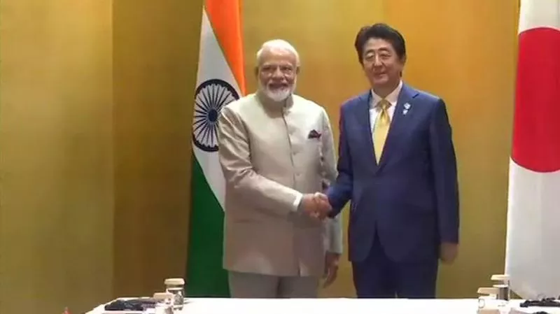 PM Modi Japan PM Discuss Global Trade - Sakshi