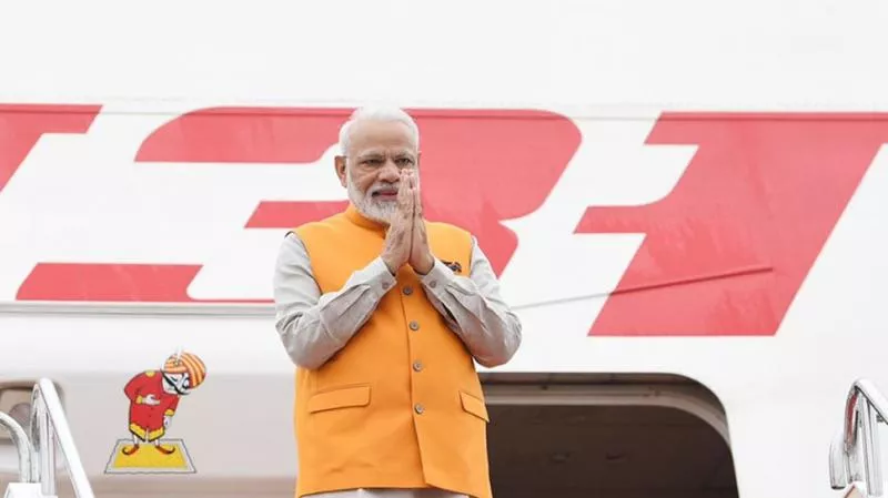 PM Modi Lands In Japans Osaka - Sakshi