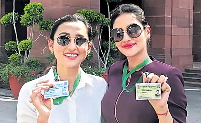 TMC MPs Mimi Chakraborty And Nusrat Jahan trolled for Parliament photos  - Sakshi