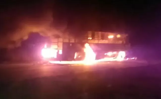 Private Travels Bus Catches Fire At Kurnool - Sakshi