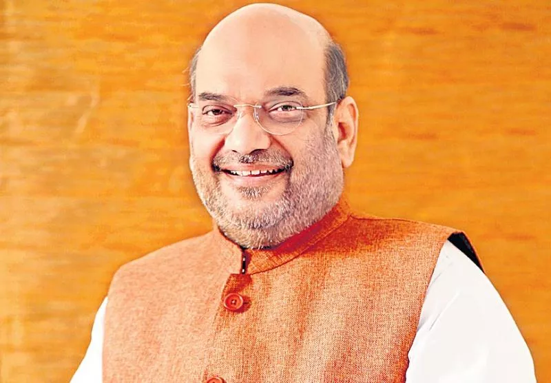 PM Narendra Modi rejigs cabinet committees, Amit Shah gets seat in all 8 - Sakshi